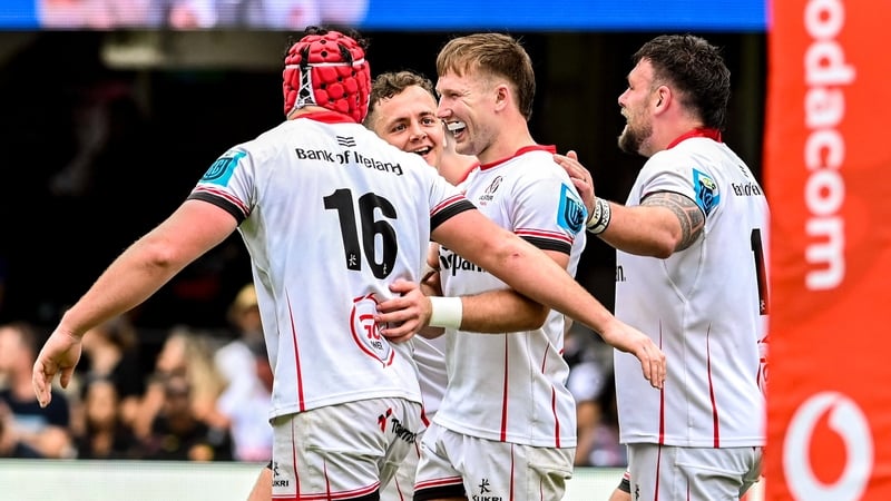 Tom Stewart, 16 celebrates with teammates after scoring his side's third try