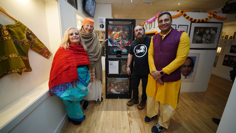 Museum owner Roag Best is joined by Hare Krishna followers with a pendant belonging to George Harrison on display at Liverpool Beatles Museum on Saturday, on what would have been the guitarist and songwriter's 80th birthday. Picture: PA