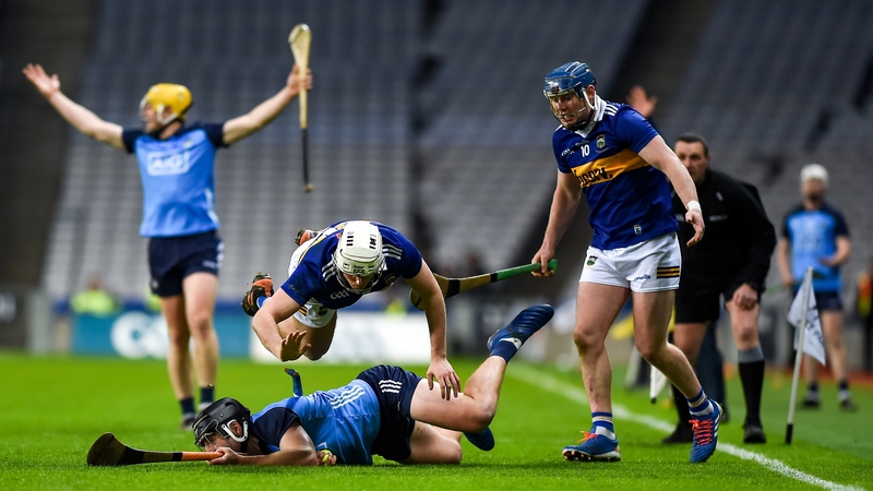 Donal Burke of Dublin is tackled by Johnny Ryan