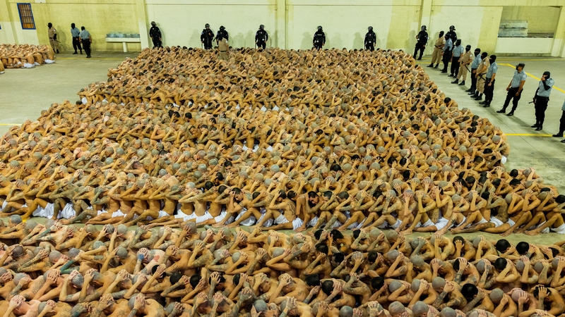 Some of the thousands of prisoners due to be transferred await being moved to their cells