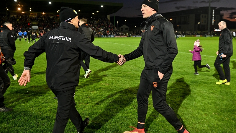 Kerry manager Jack O'Connor (L) shakes hands with Armagh selector Kieran Donaghy