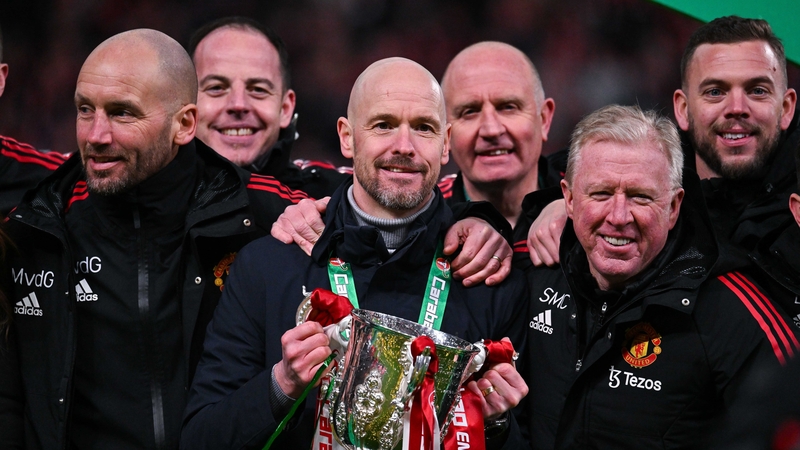 Ten Hag and his coaching staff with the silverware