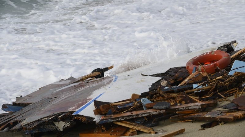 The wreckage of the ship is seen on a beach in Calabria