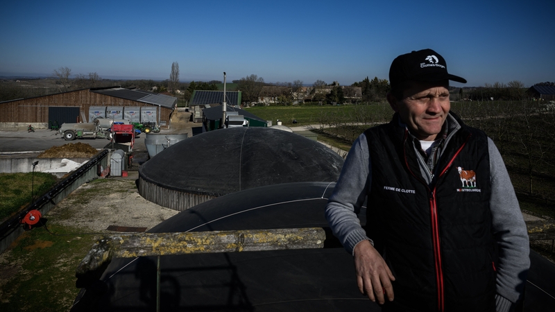 Bertrand Guerin stands near biomethane units on his farm which produces biomethane, also known as renewable natural gas