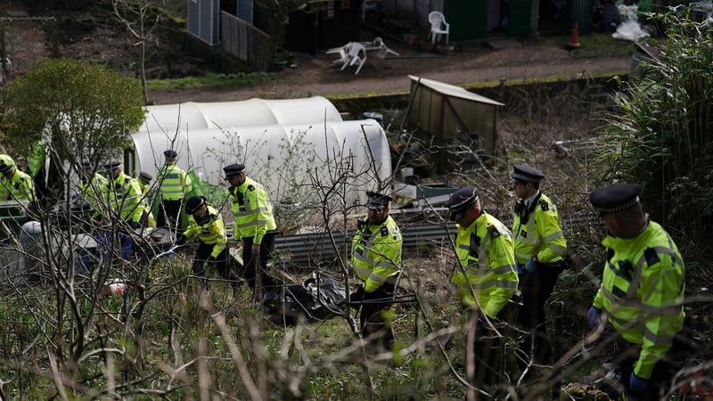 Police search teams in Roedale Valley Allotments, Brighton for the baby