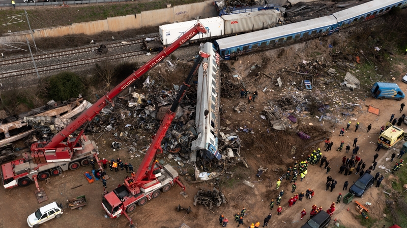 Cranes lift wreckage from the crash site
