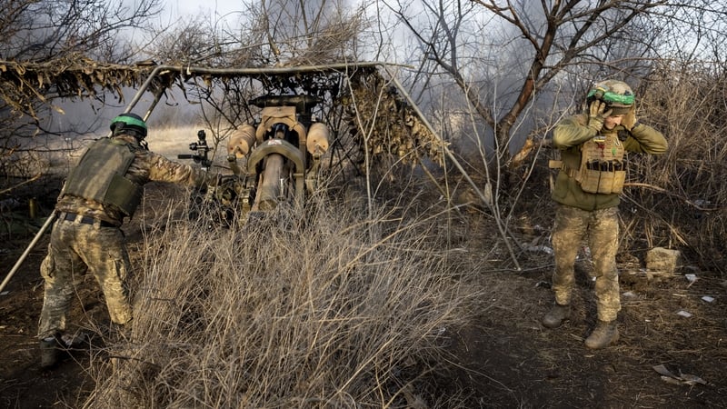 Soldiers from a Ukrainian assault brigade fire a British made L118 105mm Howitzer on Russian frontline trenches outside Bakhmut. Photo: John Moore/Getty Images