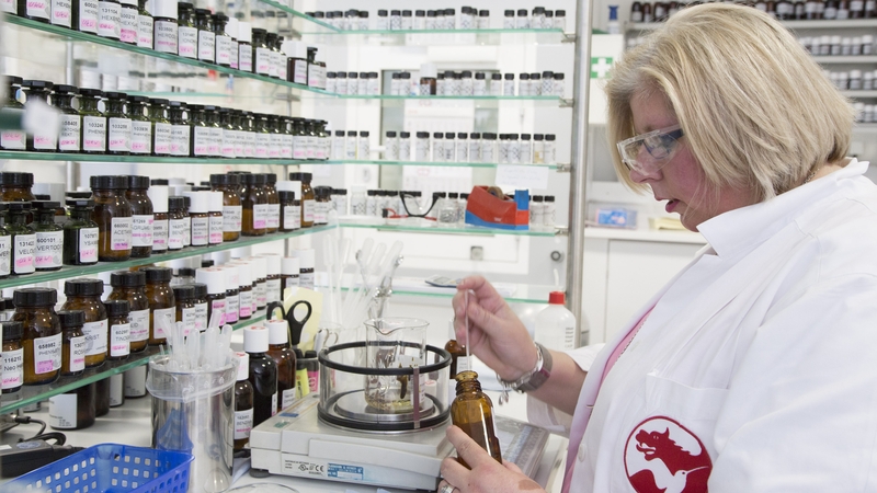 An employee mixes perfumes in a laboratory at the Symrise plant in Germany