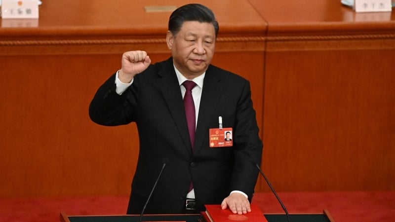 Xi Jinping takes the oath after being re-elected as president for a third term