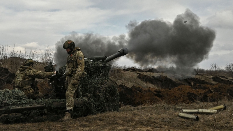 Ukrainian servicemen fire a 105mm howitzer towards Russian positions near the city of Bakhmut