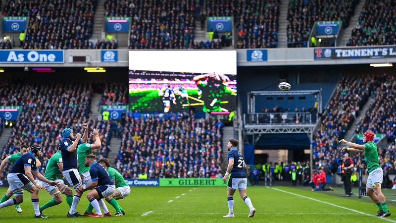 Ireland flanker Josh van der Flier (R) throwing the ball in at a lineout