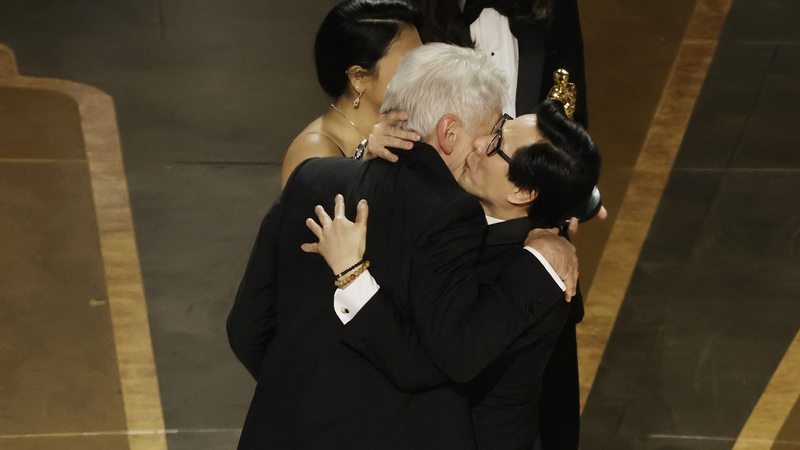 Ke Huy Quan (R) accepts the award for Best Picture for Everything Everywhere All at Once from Harrison Ford onstage during the 95th Annual Academy Awards at Dolby Theatre. (Photo by Kevin Winter/Getty Images)