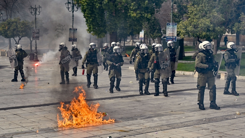 Police fired tear gas and stun grenades as demonstrators tried to surround them, hurling firebombs and rocks
