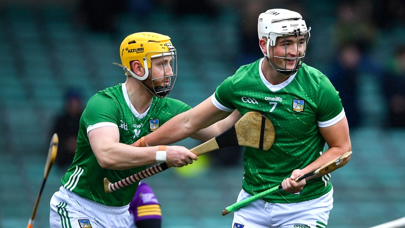 Kyle Hayes, right, celebrates with teammate Seamus Flanagan after scoring Limerick's first goal