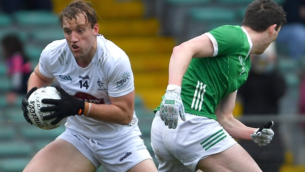 Darragh Kirwan evades Michael Donovan