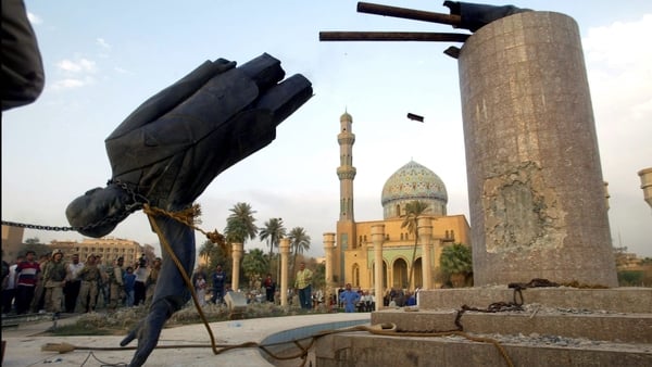 US troops topple a statue of Saddam Hussein on 9 April 2003 in Baghdad, Iraq