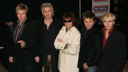 Duran Duran with Andy Taylor (centre) in New York in October 2004 - "The new recordings will feature extended Duran Duran family and friends, old and new, including our former bandmate Andy Taylor who will join us on guitar for a few tracks"