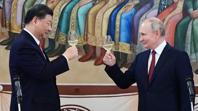 Xi Jinping and Vladimir make a toast during a reception following their talks at the Kremlin