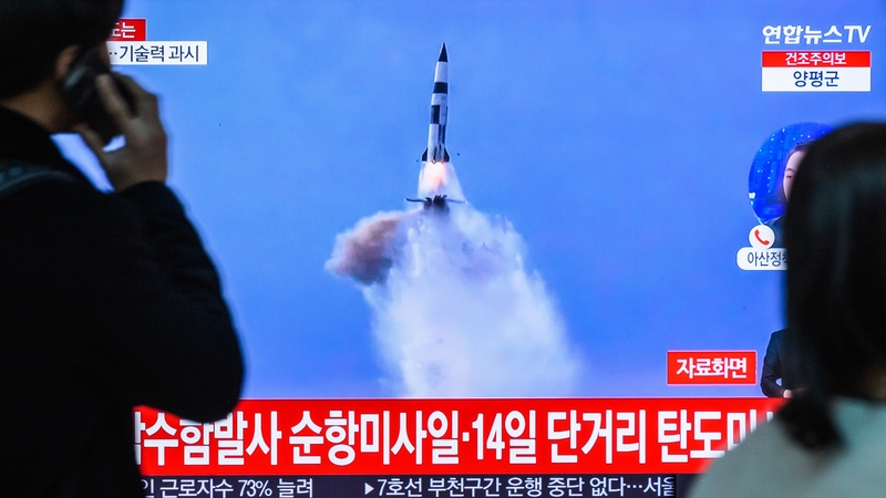 People watch file footage of a North Korea missile launch during a news programme in Seoul