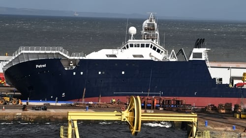 Research vessel 'Petrel' tipped at a 45-degree angle in the Imperial Dock area in Leith, Scotland