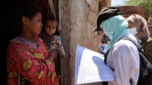 Health workers talk to civilians during a polio immunisation campaign in Yemen's city of Taez earlier this month
