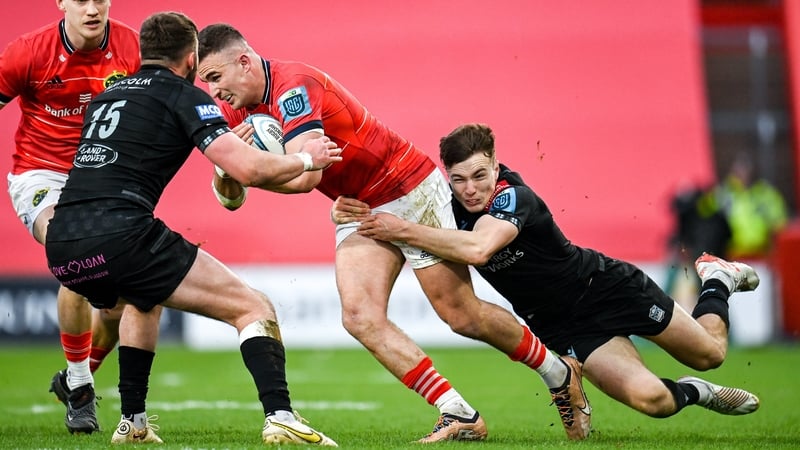 Shane Daly of Munster is tackled by Jamie Dobie of Glasgow Warriors
