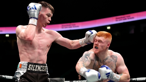 Aaron McKenna (L) lands a punch on Jordan Grant