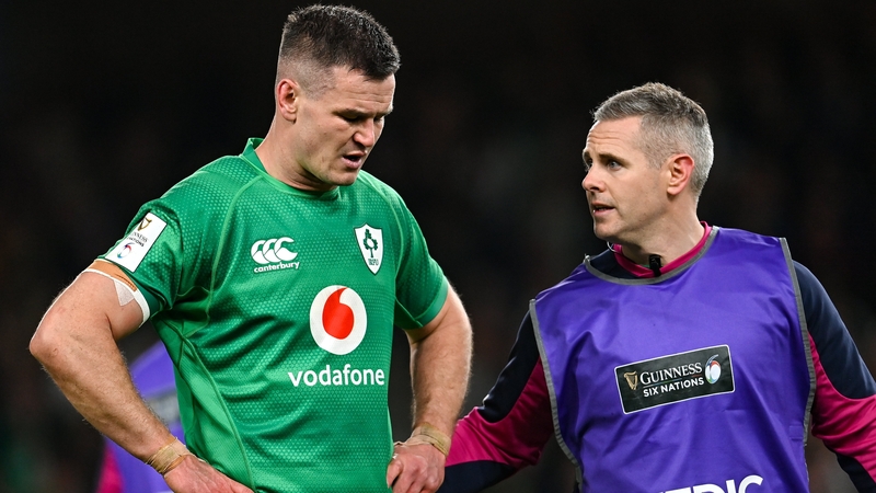 Sexton leaves the Aviva Stadium pitch with the injury against England