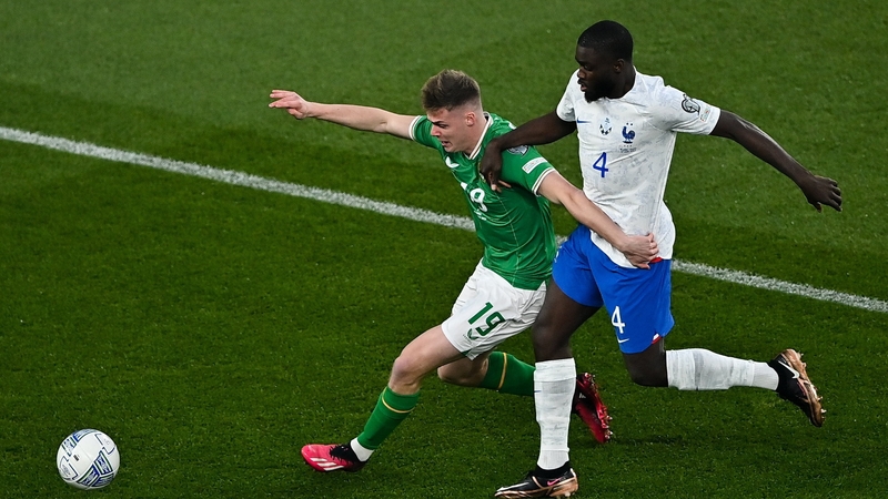 Evan Ferguson tussles with France defender Dayot Upamecano during the Euro 2024 qualifier in Dublin