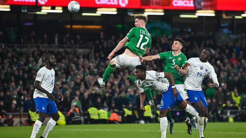 Nathan Collins guides his late header on target only to be denied by an incredible Mike Maignan save