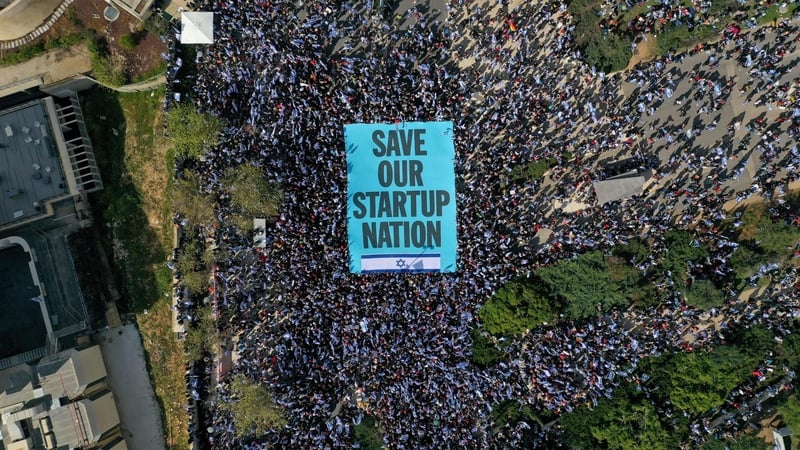 Protesters outside Israel's parliament demonstrate against the government's decision to overhaul the justice system