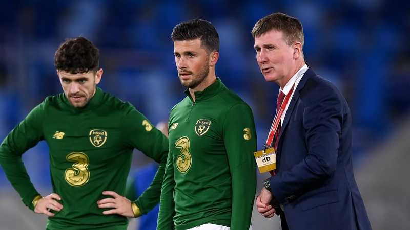 Republic of Ireland manager Stephen Kenny (far right) speaking to Shane Long in October 2020
