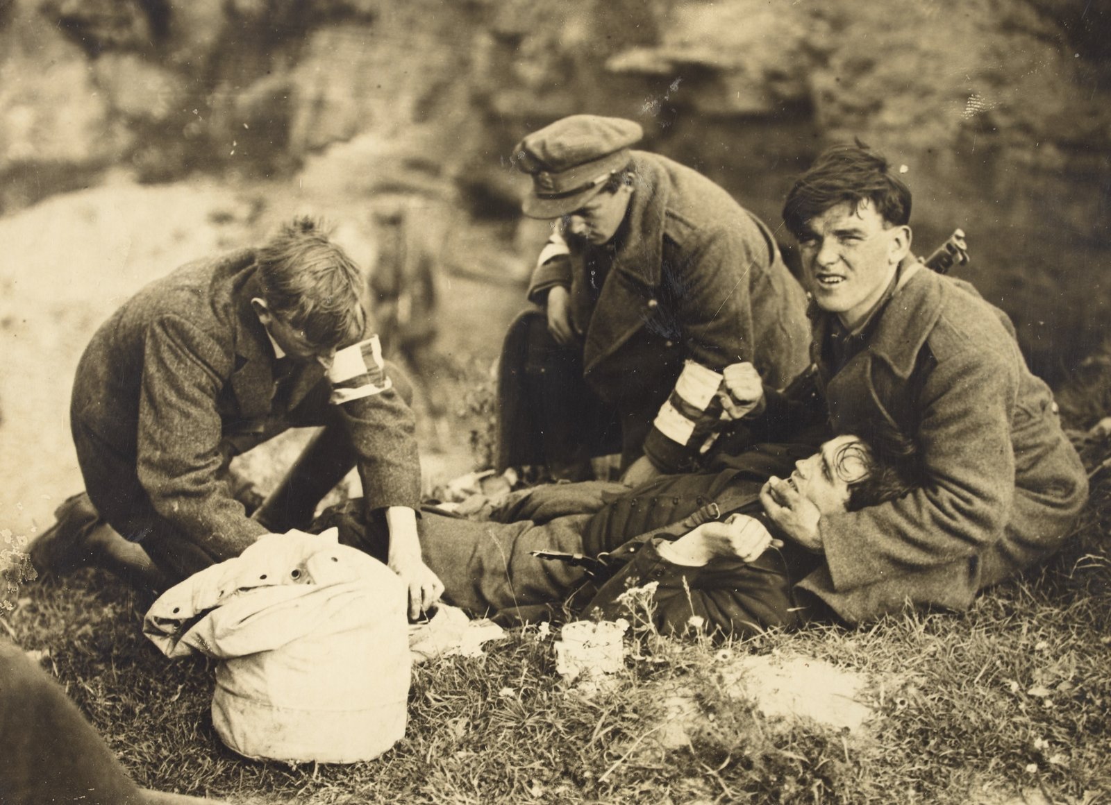 Not every engagement went the Army's way; medics attend a wounded man. (Credit: National Library of Ireland)