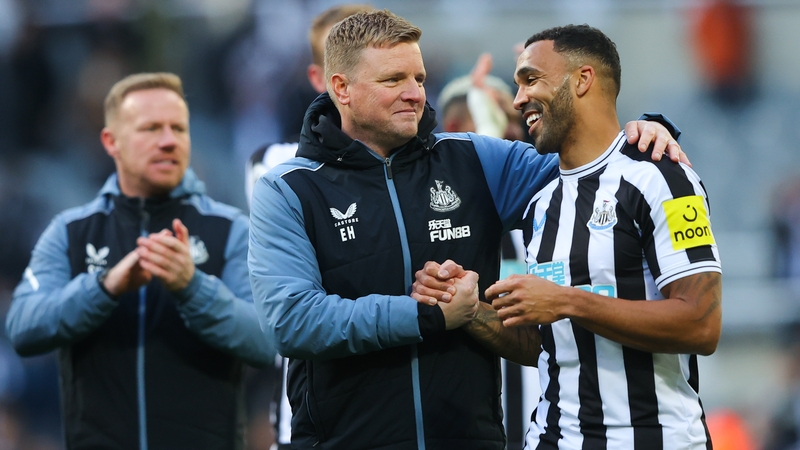 Eddie Howe (C) celebrates with Newcastle goalscorer Callum Wilson after they beat Manchester United