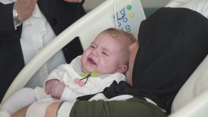 The three-and-a-half-month old 'miracle baby', called Vetin, was pulled out of the rubble of a building more than five days after the earthquake