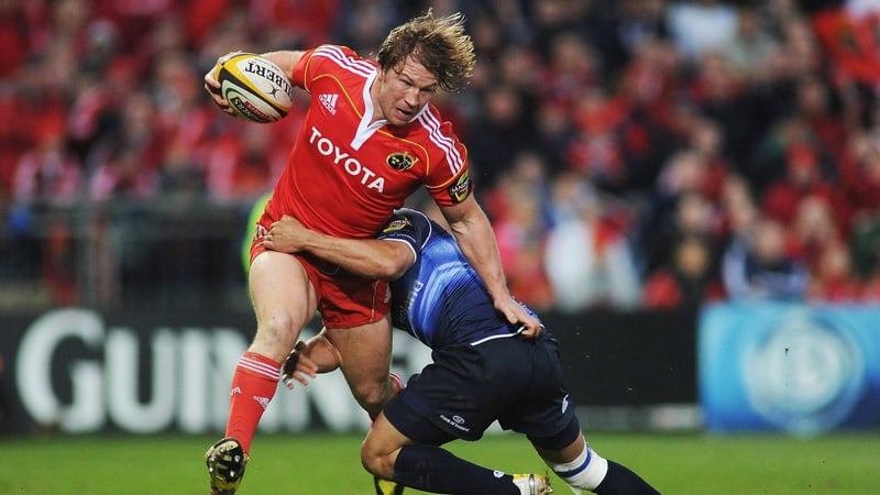 Jerry Flannery is tackled by Isa Nacewa in the Munster-Leinster clash on Good Friday, 2 April