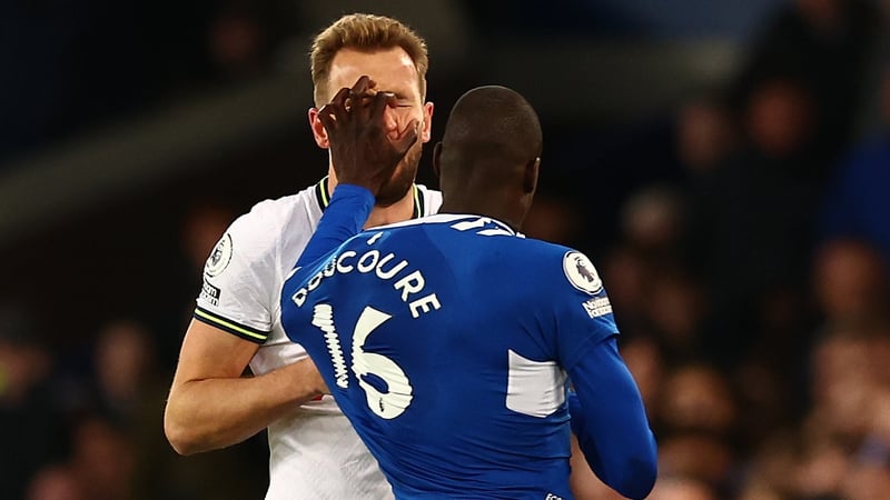 Abdoulaye Doucoure earned a straight red for this grab and push of Harry Kane