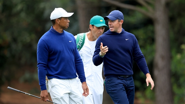 Tiger Woods (L) and Rory McIlroy during a practice round at Augusta on Monday