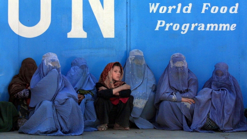 A file picture of women queuing out the UN World Food Programme