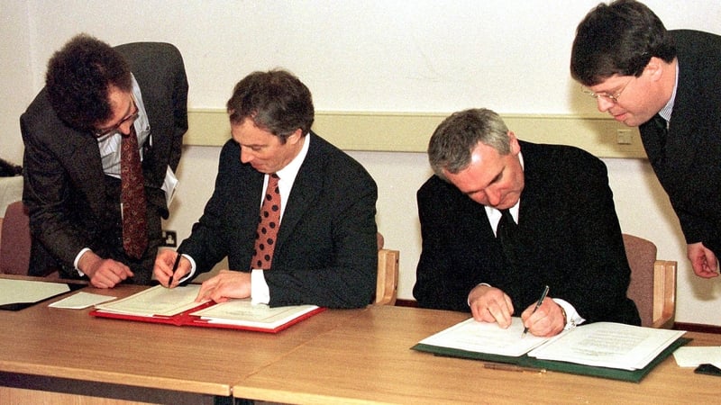 Former British Prime Minister Tony Blair, left, and then Taoiseach Bertie Ahern signing the Good Friday peace agreement in 1998