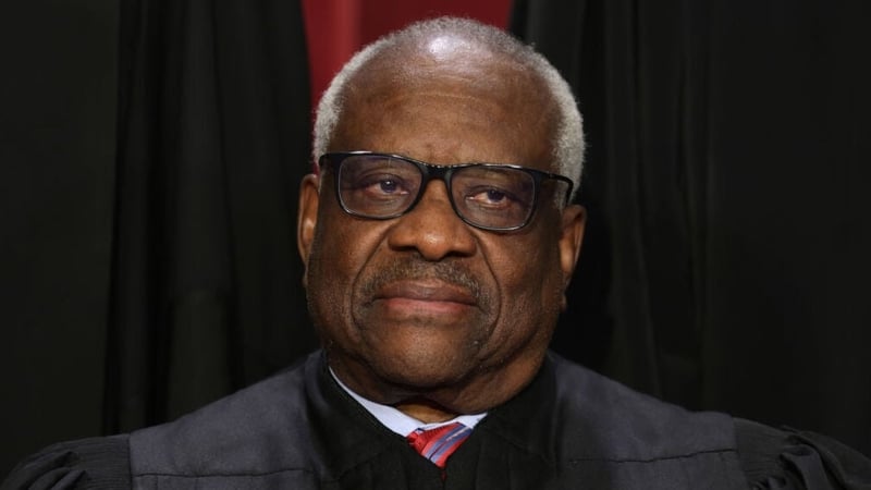 Justice Clarence Thomas poses for an official portrait at the East Conference Room of the Supreme Court building on October 2022