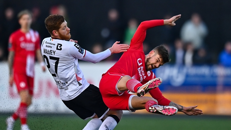 Frank Liivak of Sligo Rovers is tackled by Connor Malley
