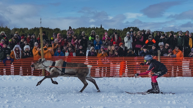 Spectators watch the race on the frozen lake of Inari in Finland