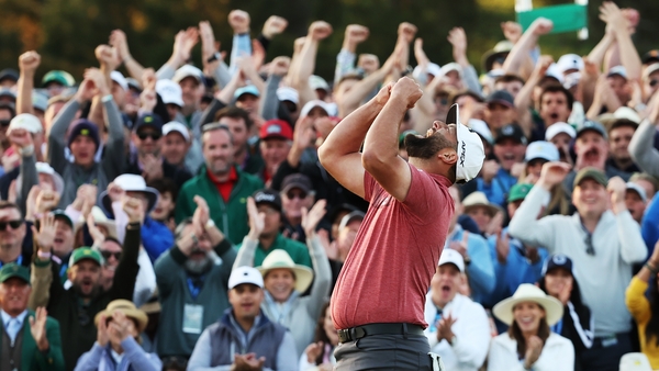 Rahm celebrates his victory on the 18th green