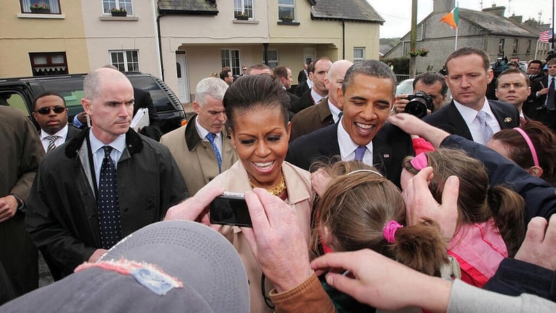 Barack and Michelle Obama greet locals in his ancestral home of Moneygall in May 2011