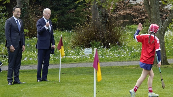 Joe Biden (R) and Leo Varadkar were watching a group of girls play a camogie match at Farmleigh House