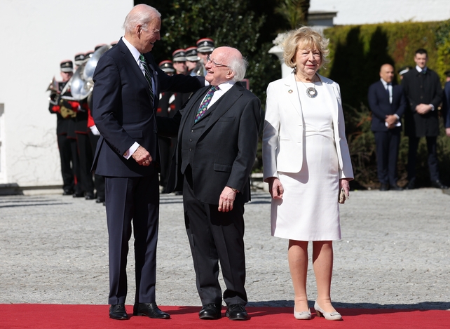 'Dia duit' - President Michael D Higgins greets Joe Biden as he arrives at Áras an Uachtaráin this afternoon