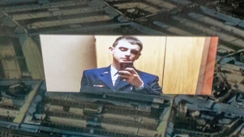 An illustration shows national guardsman Jack Teixeira reflected in an image of the Pentagon