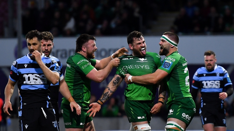 Conor Oliver celebrates with team-mates Dylan Tierney-Martin, left, and Shamus Hurley-Langton, right, after scoring Connacht's third try