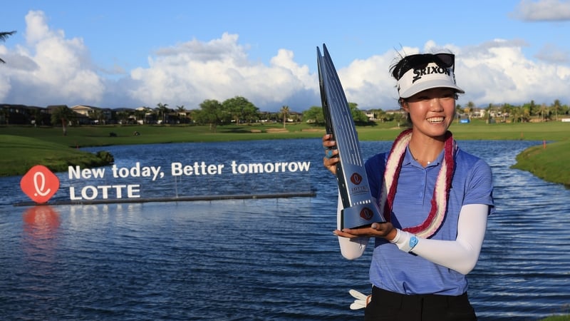 Grace Kim poses with the Lotte Championship trophy
